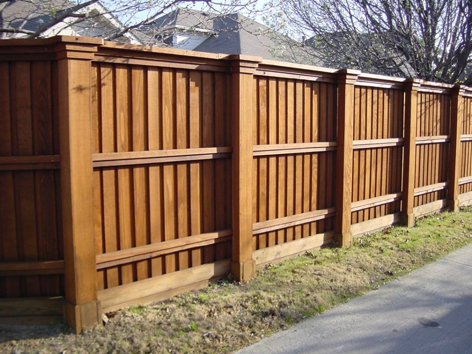 Large brown fence in yard