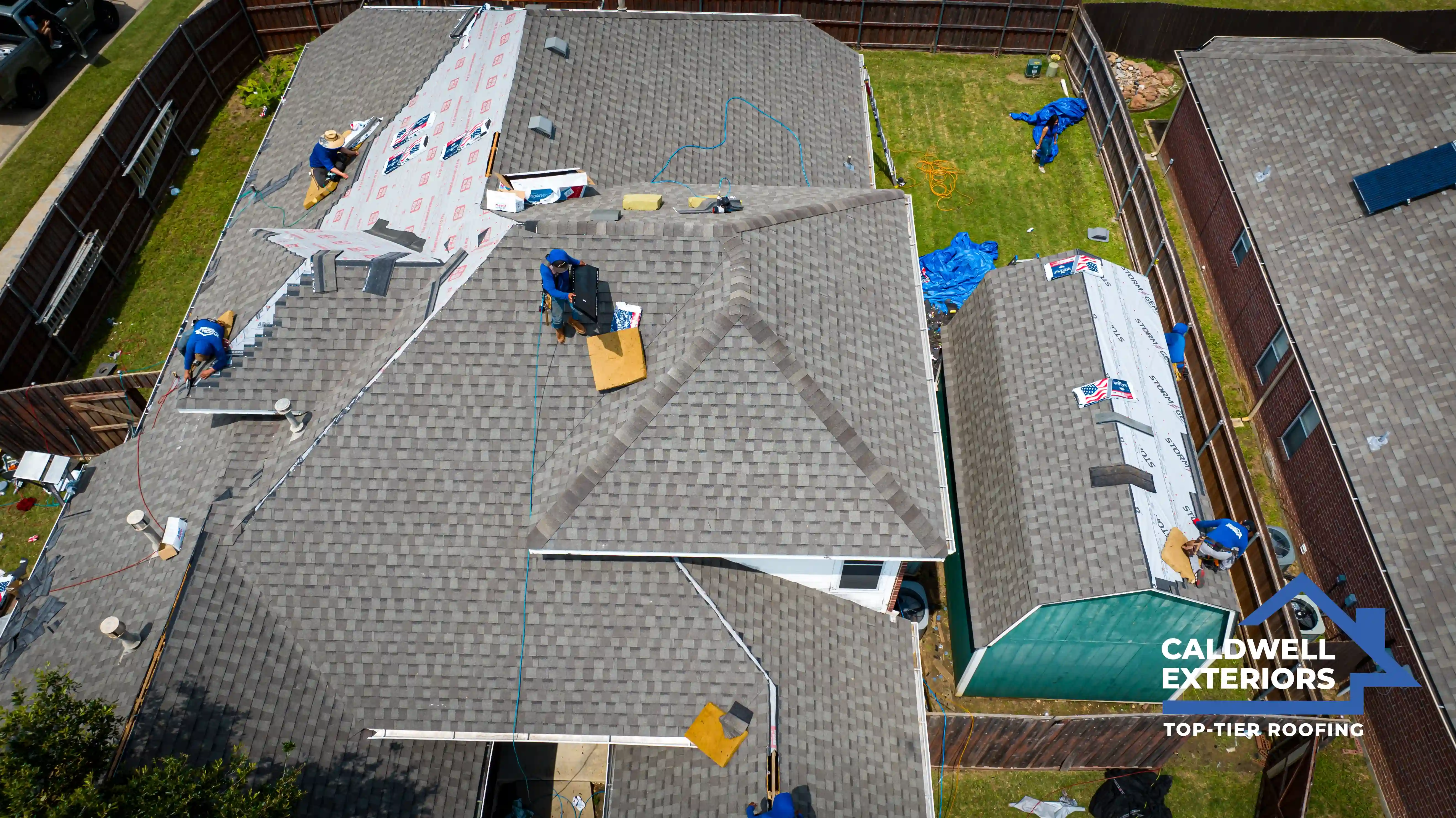 Caldwell Exteriors team working on roof